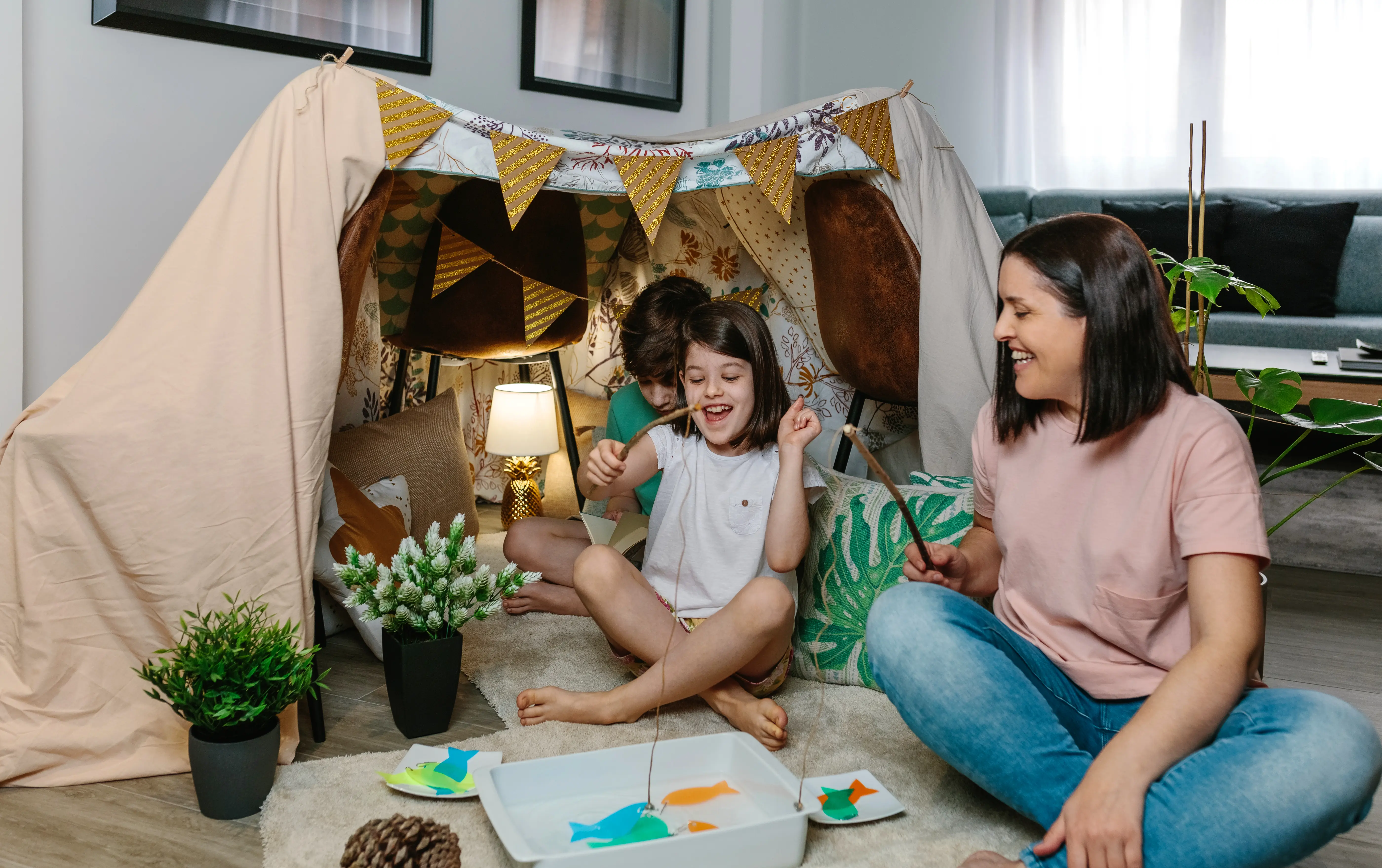 Family Playing Together in Living Room Tent
